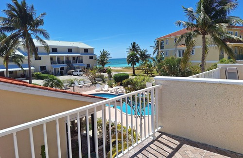 Bahamas Terrace Condo | 2-bdrm condo in Freeport, steps from the pool and beach with beach chairs &WiFi.