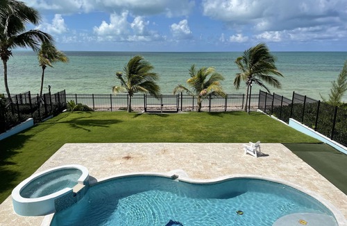 Coral Harbour House | Blue Birds Beach House, comfortable beach readaway with a heated pool