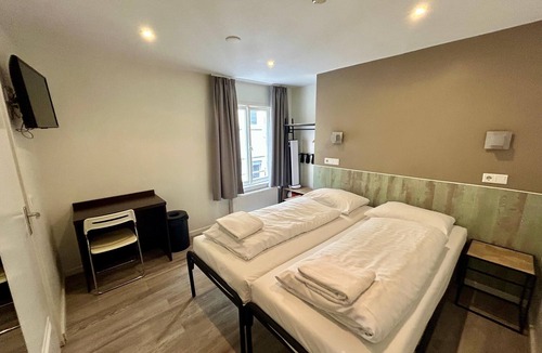 Burgwallen Nieuwe Zijde Hotel | Hotel Damrak Inn