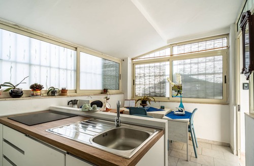 Carbonia House | Intimate, quiet studio apartment with a small living room and equipped kitchen