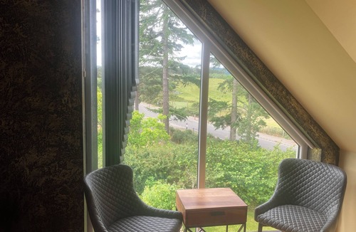 Farr Apartment | Kick back and relax in this calm, stylish with views of beautiful Strathnairn.