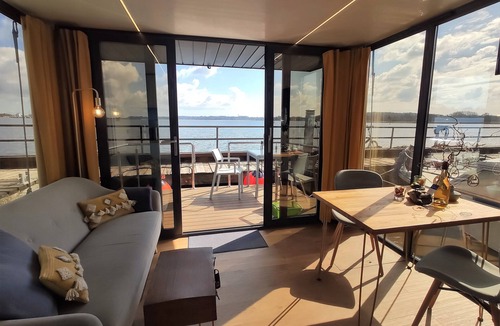 Schleswig Boat Rental | Relaxing vacation on houseboat Hilja with a great view of the Schlei (dog-friendly)
