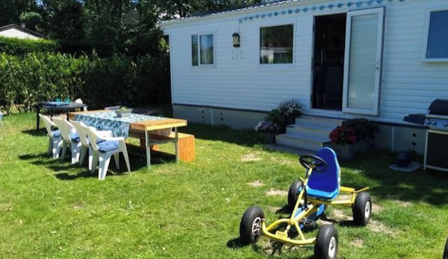 Neat chalet on child-friendly campsite close to beach, town, dunes and forest.