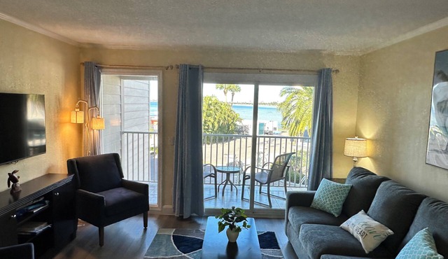 Newly remodeled with sunset views! Heated pool, private beach and family owned!