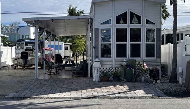 Tiny Home in Calusa campground with ample parking for truck and boat.